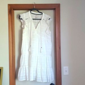 White linen dress with crochet details and tassles